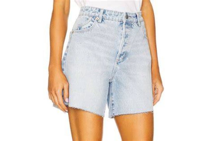 Struggle: Henry also wore shorts teamed a black T-shirt and struggled to keep his hands off his partner